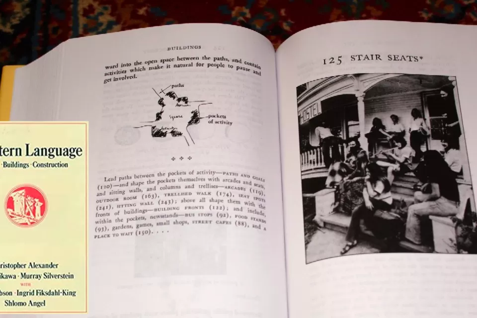 The cover of the book "A Pattern Language" by Christopher Alexander is shown next to a page from the booking--the latter shows "stair case steps."